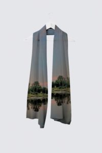 High Fashion Scarf using specialized printing to capture the mirror of the sun setting into a calm hazy lake